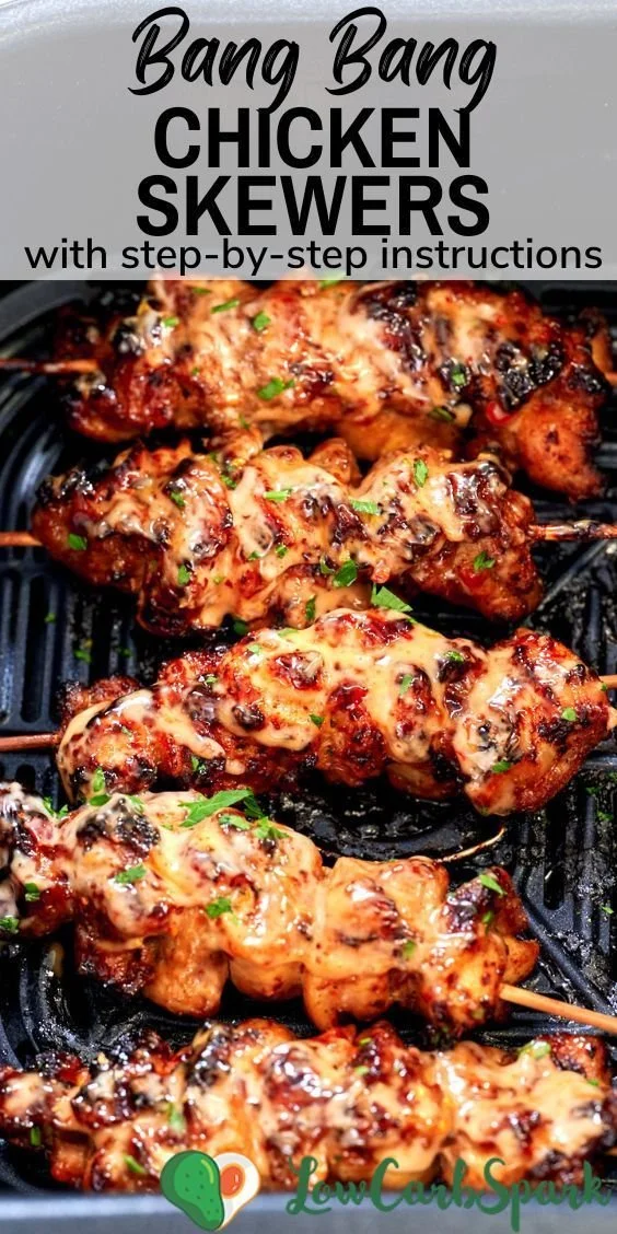 Air Fryer Bang Bang Chicken Skewers served on a plate with sauce