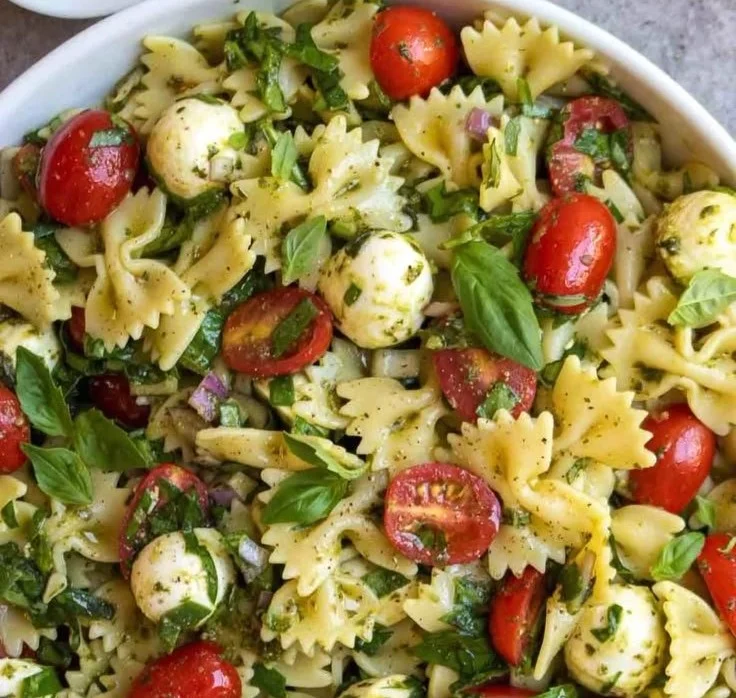 Colorful Bow Tie Pasta Salad with fresh vegetables and dressing