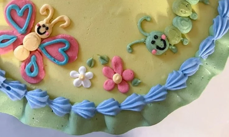Cute birthday cakes by Jordan Mulloy showcasing spring designs and whimsical decorations.