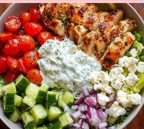 Delicious Greek Chicken Bowls with fresh vegetables and savory ingredients.