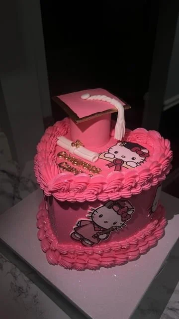 Hello Kitty Graduation Heart Cake decorated with adorable details and colors
