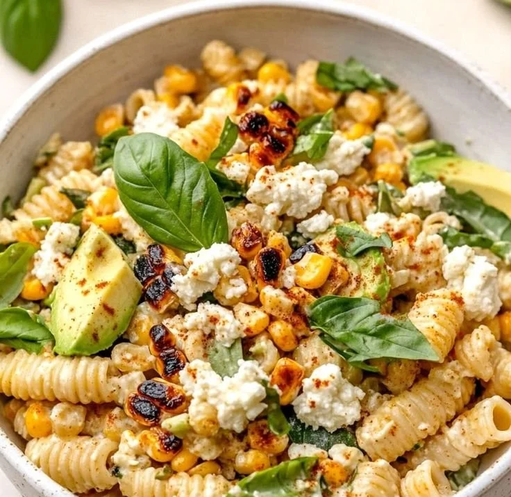 Bowl of Juicy Street Corn Pasta Salad with fresh ingredients