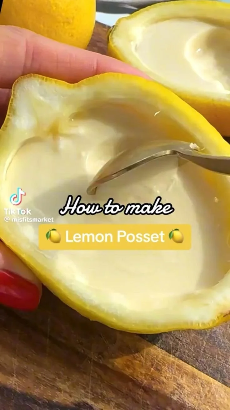 Delicious lemon cream dessert served in a bowl with a slice of lemon on top