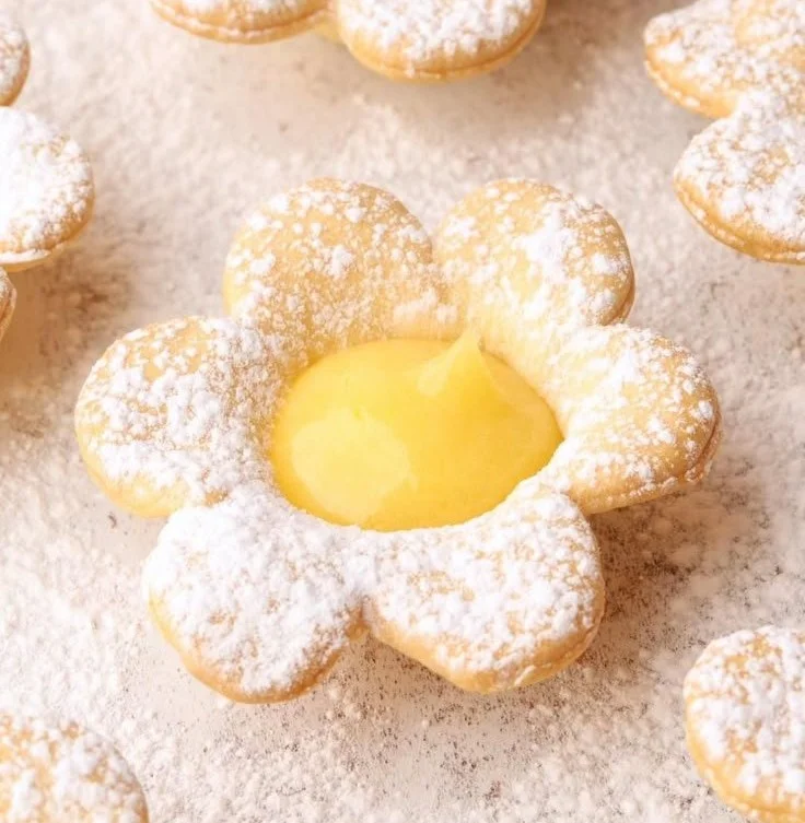 Delicious lemon curd tartlets topped with fresh berries.