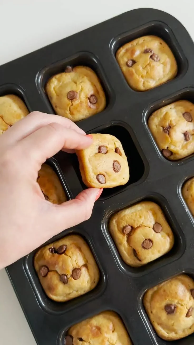Mini banana bread cake topped with nuts and banana slices
