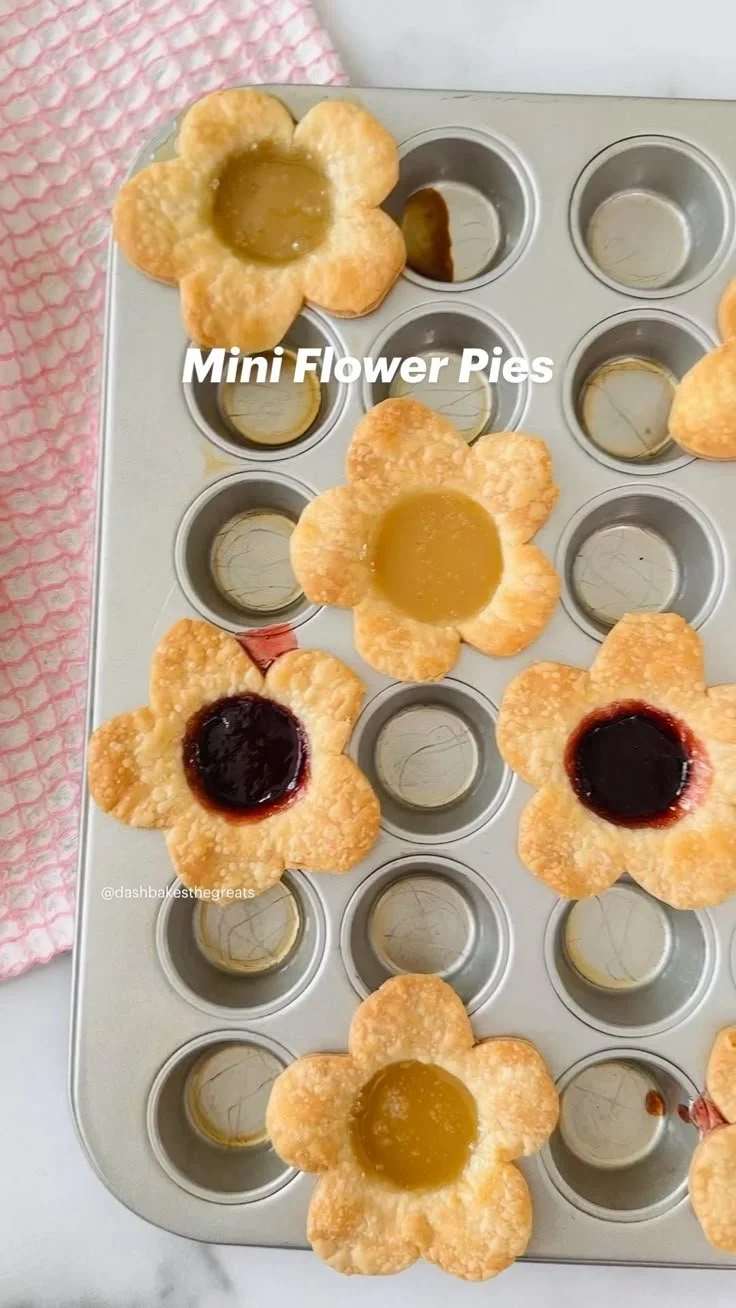Mini flower pies decorated with edible flowers for a vibrant dessert.