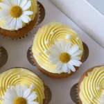 pastel yellow cupcakes with daisies and pearls 2026 03 16 012733 1