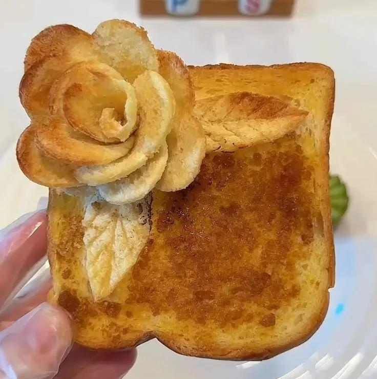 Delicious Rosa Toast topped with butter and brown sugar on a plate.